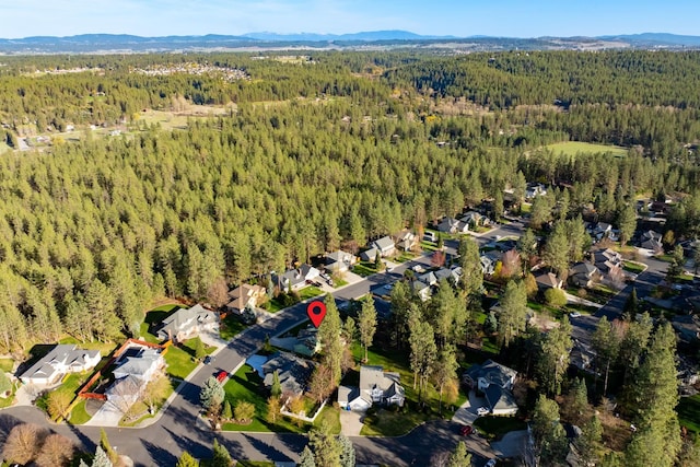 bird's eye view featuring a residential view, a forest view, and a mountain view