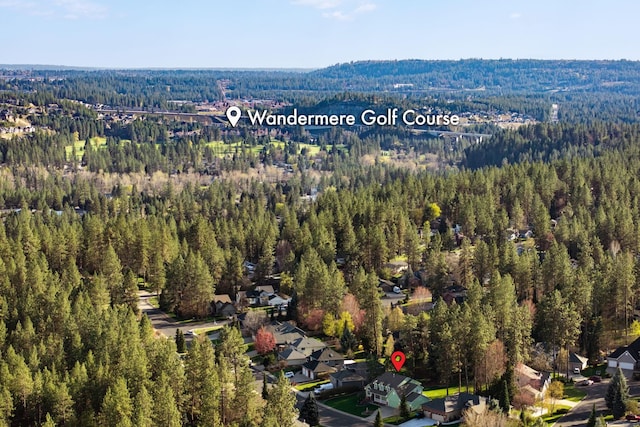 birds eye view of property featuring a residential view and a view of trees