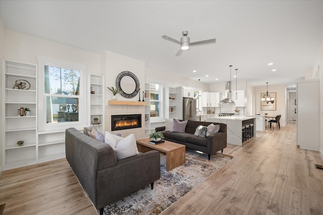 3022 S Manito Blvd, Spokane, WA 99203 - living room featuring recessed lighting, a glass covered fireplace, light wood-style flooring, and a ceiling fan