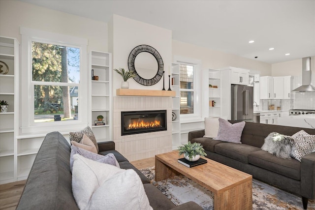 3022 S Manito Blvd, Spokane, WA 99203 - living room with wood finished floors, a fireplace, and built in shelves