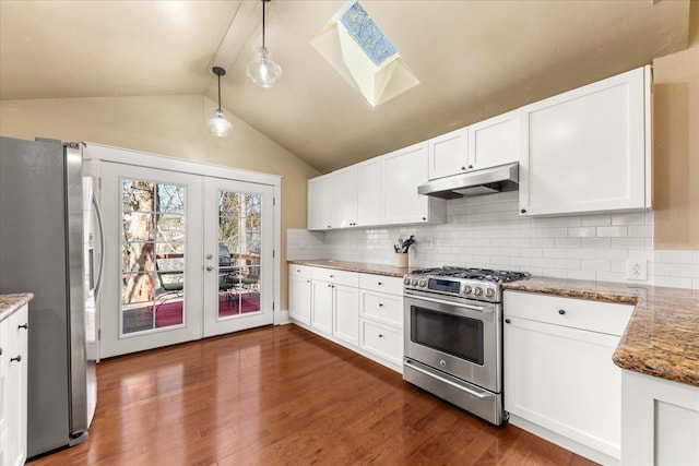 kitchen with french doors, white cabinetry, backsplash, under cabinet range hood, and appliances with stainless steel finishes