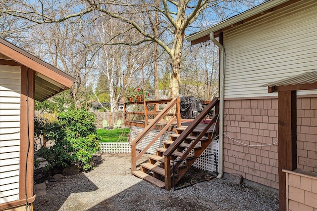 exterior space with fence and stairs