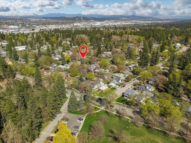 birds eye view of property with a mountain view