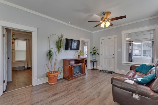 1303 E Rich Ave, Spokane, WA 99207 - living room featuring ornamental molding, baseboards, a ceiling fan, and wood finished floors