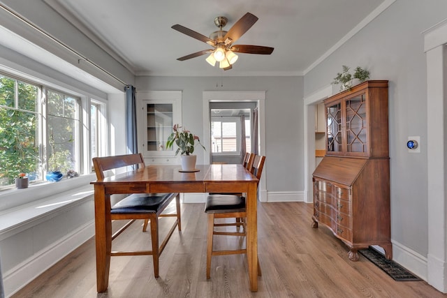 1303 E Rich Ave, Spokane, WA 99207 - dining room with plenty of natural light, light wood finished floors, baseboards, and a ceiling fan