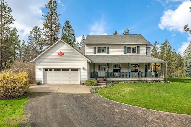 6901 W Depot Springs Rd, Cheney, WA 99004 - view of front facade featuring an attached garage, driveway, a front yard, and covered porch