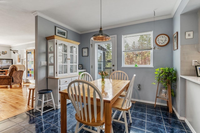 6901 W Depot Springs Rd, Cheney, WA 99004 - dining area with dark tile patterned floors, baseboards, and ornamental molding