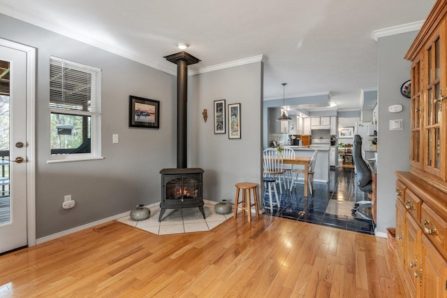 6901 W Depot Springs Rd, Cheney, WA 99004 - interior space featuring light wood finished floors, ornamental molding, and a wood stove