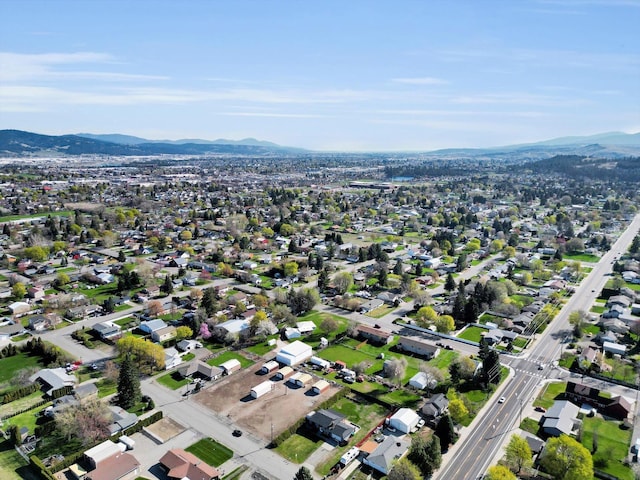 birds eye view of property with a mountain view