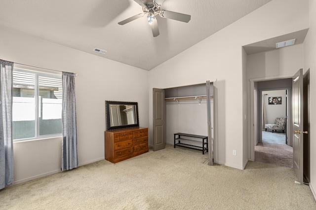 12827 W 3rd Ave, Airway Heights, WA 99001 - unfurnished bedroom featuring carpet, vaulted ceiling, a closet, and a ceiling fan