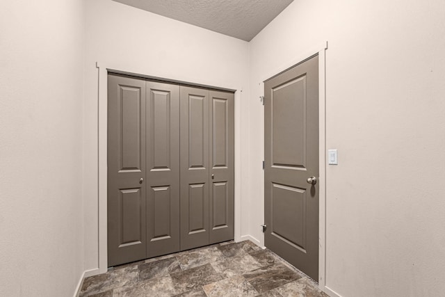 12827 W 3rd Ave, Airway Heights, WA 99001 - entryway featuring a textured ceiling and stone finish flooring