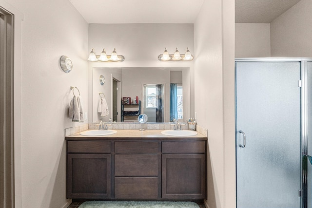 12827 W 3rd Ave, Airway Heights, WA 99001 - bathroom featuring a stall shower and double vanity