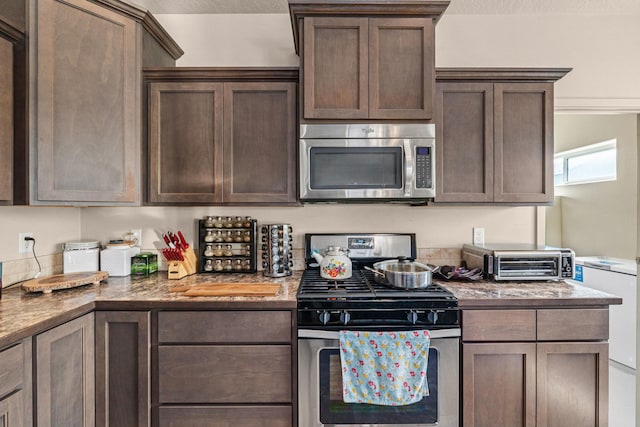 12827 W 3rd Ave, Airway Heights, WA 99001 - kitchen with appliances with stainless steel finishes and dark brown cabinets