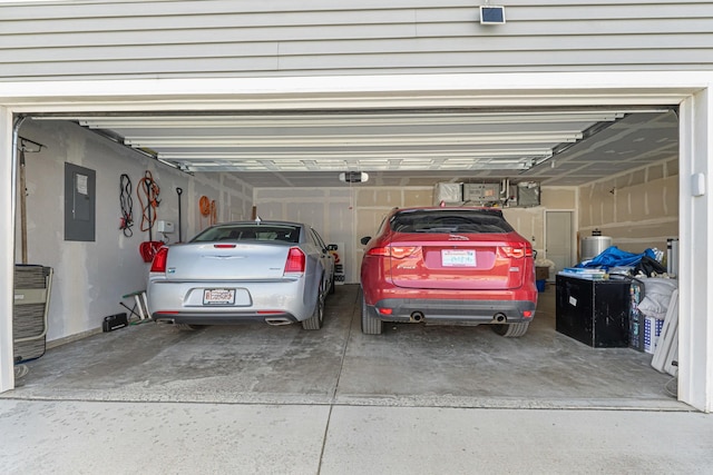 12827 W 3rd Ave, Airway Heights, WA 99001 - garage with driveway, a garage door opener, and electric panel