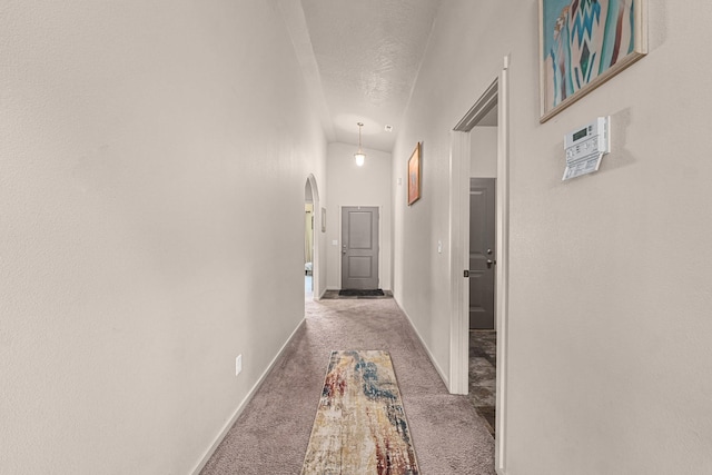 12827 W 3rd Ave, Airway Heights, WA 99001 - corridor featuring carpet flooring, arched walkways, a textured ceiling, and vaulted ceiling