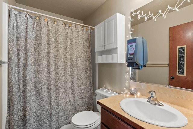 112 S Holiday Rd, Spokane Valley, WA 99016 - full bathroom with curtained shower, tasteful backsplash, toilet, and vanity