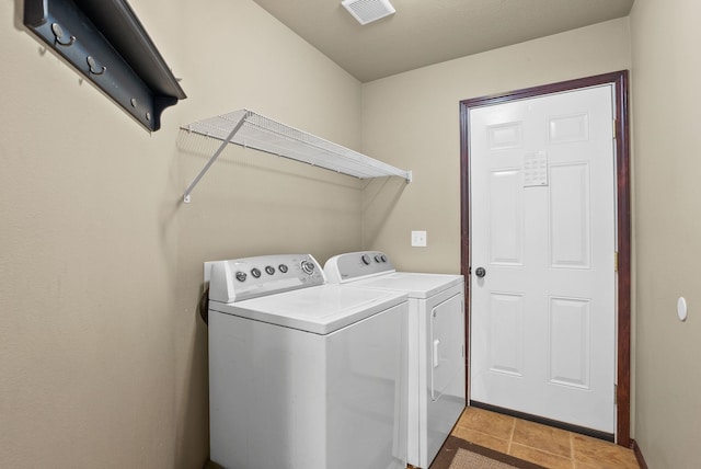 112 S Holiday Rd, Spokane Valley, WA 99016 - laundry area featuring visible vents, washer and clothes dryer, laundry area, and light tile patterned floors