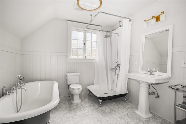 530 E 11th Ave, Spokane, WA 99202 - bathroom with a shower with curtain, a freestanding tub, wainscoting, toilet, and lofted ceiling