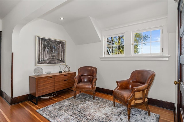 530 E 11th Ave, Spokane, WA 99202 - living area featuring baseboards, vaulted ceiling, and wood finished floors