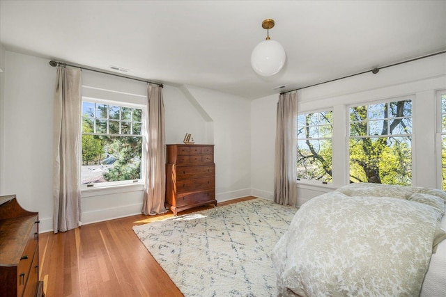 530 E 11th Ave, Spokane, WA 99202 - bedroom featuring visible vents, baseboards, and wood finished floors