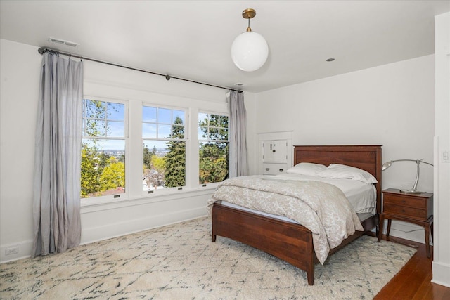 530 E 11th Ave, Spokane, WA 99202 - bedroom with visible vents, baseboards, and wood finished floors