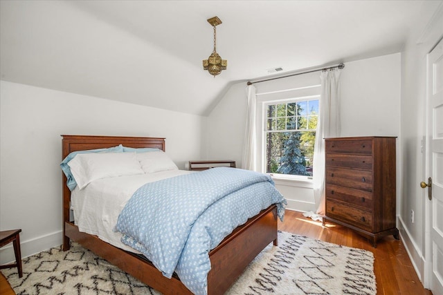 530 E 11th Ave, Spokane, WA 99202 - bedroom with visible vents, baseboards, wood finished floors, and vaulted ceiling