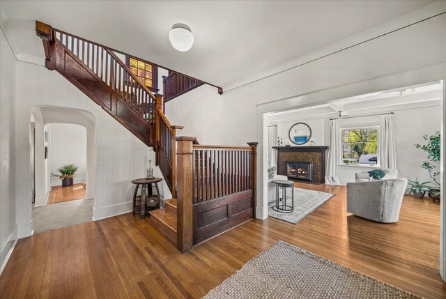 530 E 11th Ave, Spokane, WA 99202 - staircase with crown molding, arched walkways, and wood finished floors