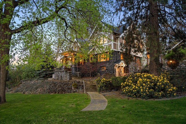 530 E 11th Ave, Spokane, WA 99202 - exterior space featuring stairway, a front lawn, and stone siding