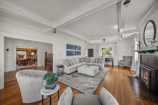 530 E 11th Ave, Spokane, WA 99202 - living room with baseboards, a fireplace with flush hearth, wood finished floors, and beamed ceiling