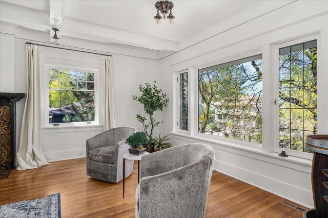 530 E 11th Ave, Spokane, WA 99202 - sitting room featuring visible vents, crown molding, wood finished floors, baseboards, and beamed ceiling