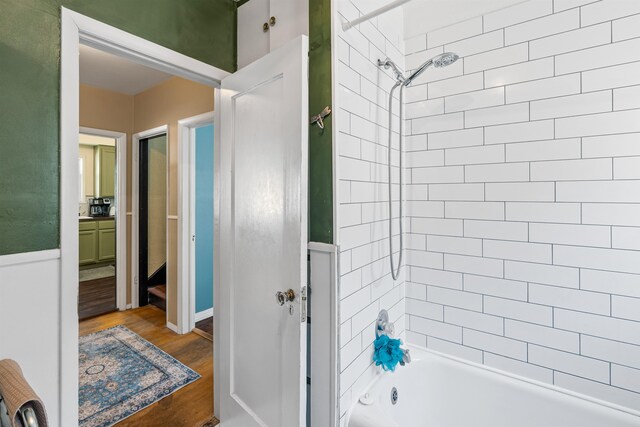 1607 W 11th Ave, Spokane, WA 99204 - bathroom with shower / washtub combination, wood finished floors, and vanity