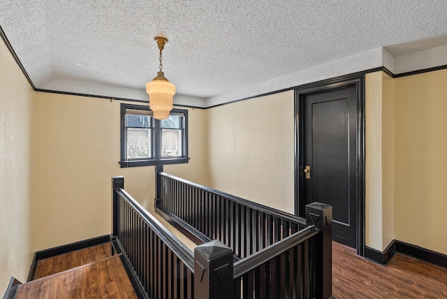 1607 W 11th Ave, Spokane, WA 99204 - staircase with wood finished floors and a textured ceiling