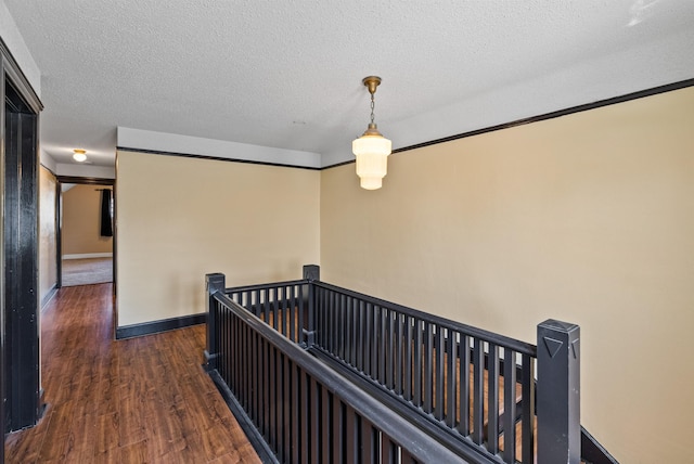 1607 W 11th Ave, Spokane, WA 99204 - hallway with an upstairs landing, wood finished floors, and a textured ceiling