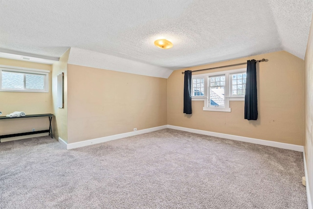 1607 W 11th Ave, Spokane, WA 99204 - carpeted empty room with lofted ceiling and a textured ceiling