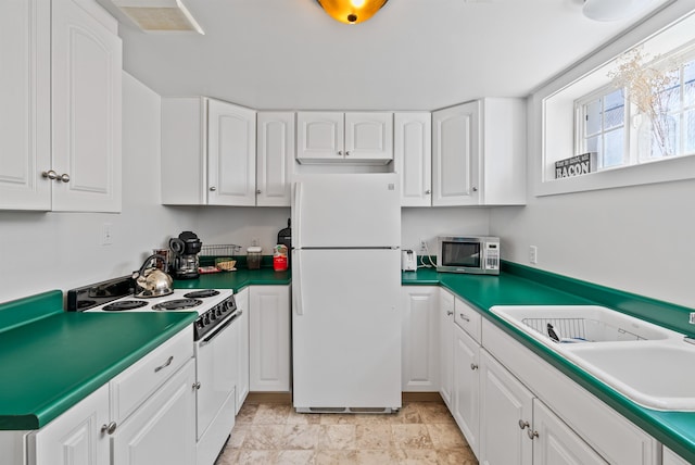 1607 W 11th Ave, Spokane, WA 99204 - kitchen featuring white appliances and white cabinets