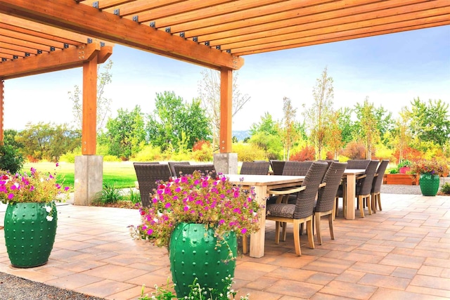 view of patio / terrace with a pergola and outdoor dining space