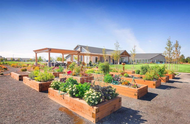 view of home's community featuring a pergola and a garden