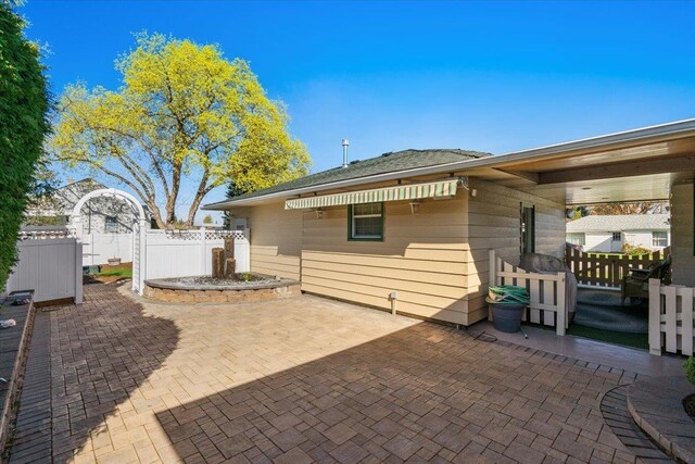 back of house with fence and a patio area
