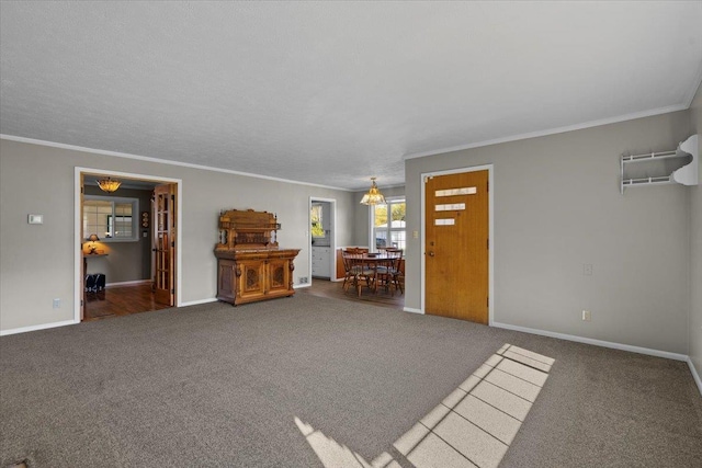 living area with baseboards, an AC wall unit, carpet, and crown molding