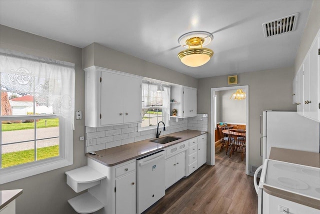kitchen with open shelves, visible vents, white appliances, a sink, and white cabinetry