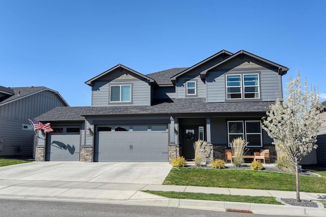 craftsman house featuring a porch, roof with shingles, and stone siding