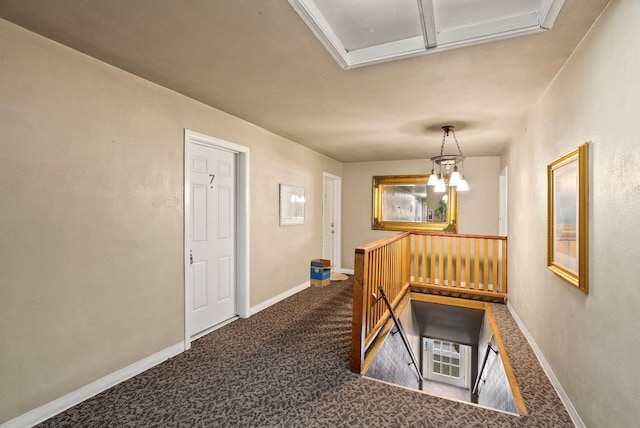 901 S Lincoln St, Spokane, WA 99204 - hall with carpet floors, baseboards, a notable chandelier, and an upstairs landing