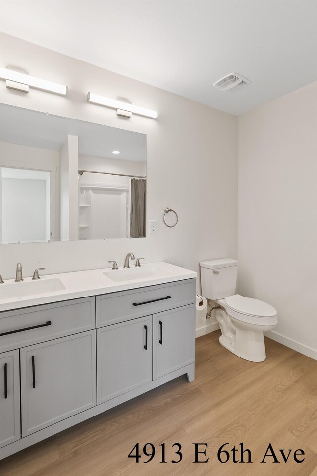 4913 E 6th Avenue 4915E 6Th Ave, Spokane Valley, WA 99212 - bathroom with baseboards, visible vents, and a sink