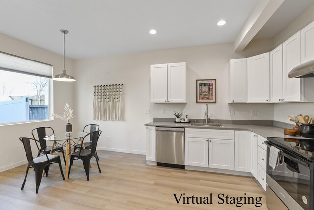 4913 E 6th Avenue 4915E 6Th Ave, Spokane Valley, WA 99212 - kitchen with light wood-type flooring, a sink, white cabinetry, and appliances with stainless steel finishes