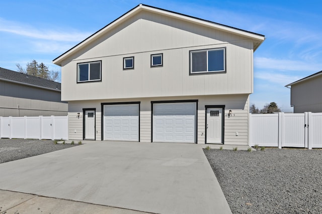 4913 E 6th Avenue 4915E 6Th Ave, Spokane Valley, WA 99212 - view of front of home featuring fence, driveway, and a garage