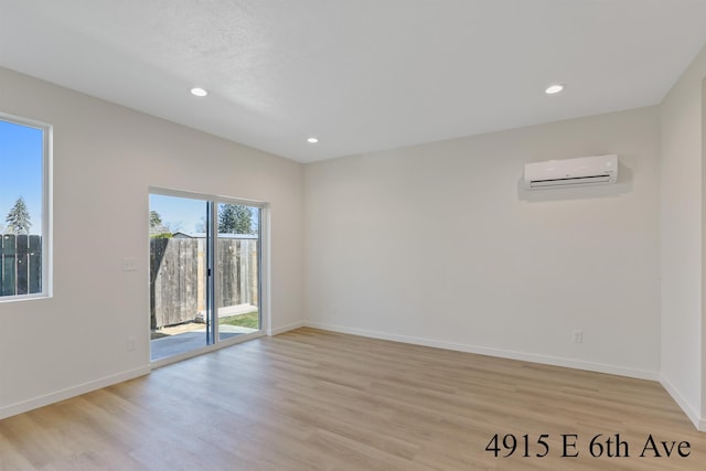 4913 E 6th Avenue 4915E 6Th Ave, Spokane Valley, WA 99212 - unfurnished room with recessed lighting, a wall mounted AC, light wood-style floors, and baseboards