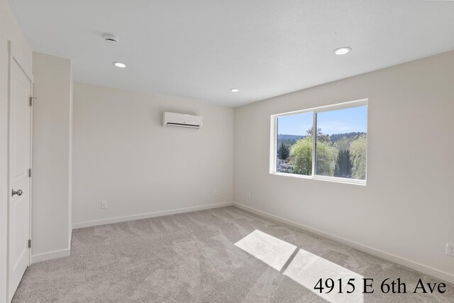 4913 E 6th Avenue 4915E 6Th Ave, Spokane Valley, WA 99212 - unfurnished room with light carpet, baseboards, a wall mounted AC, and recessed lighting
