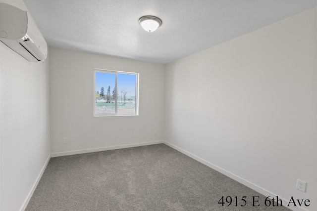 4913 E 6th Avenue 4915E 6Th Ave, Spokane Valley, WA 99212 - unfurnished room with baseboards, carpet flooring, and a wall unit AC
