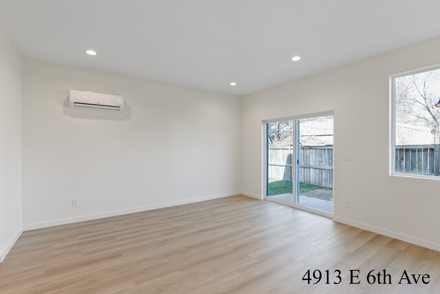 4913 E 6th Avenue 4915E 6Th Ave, Spokane Valley, WA 99212 - spare room featuring baseboards, recessed lighting, light wood-style floors, and a wall unit AC