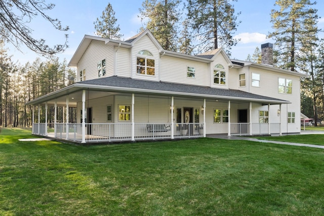 farmhouse with a chimney, a shingled roof, and a front yard